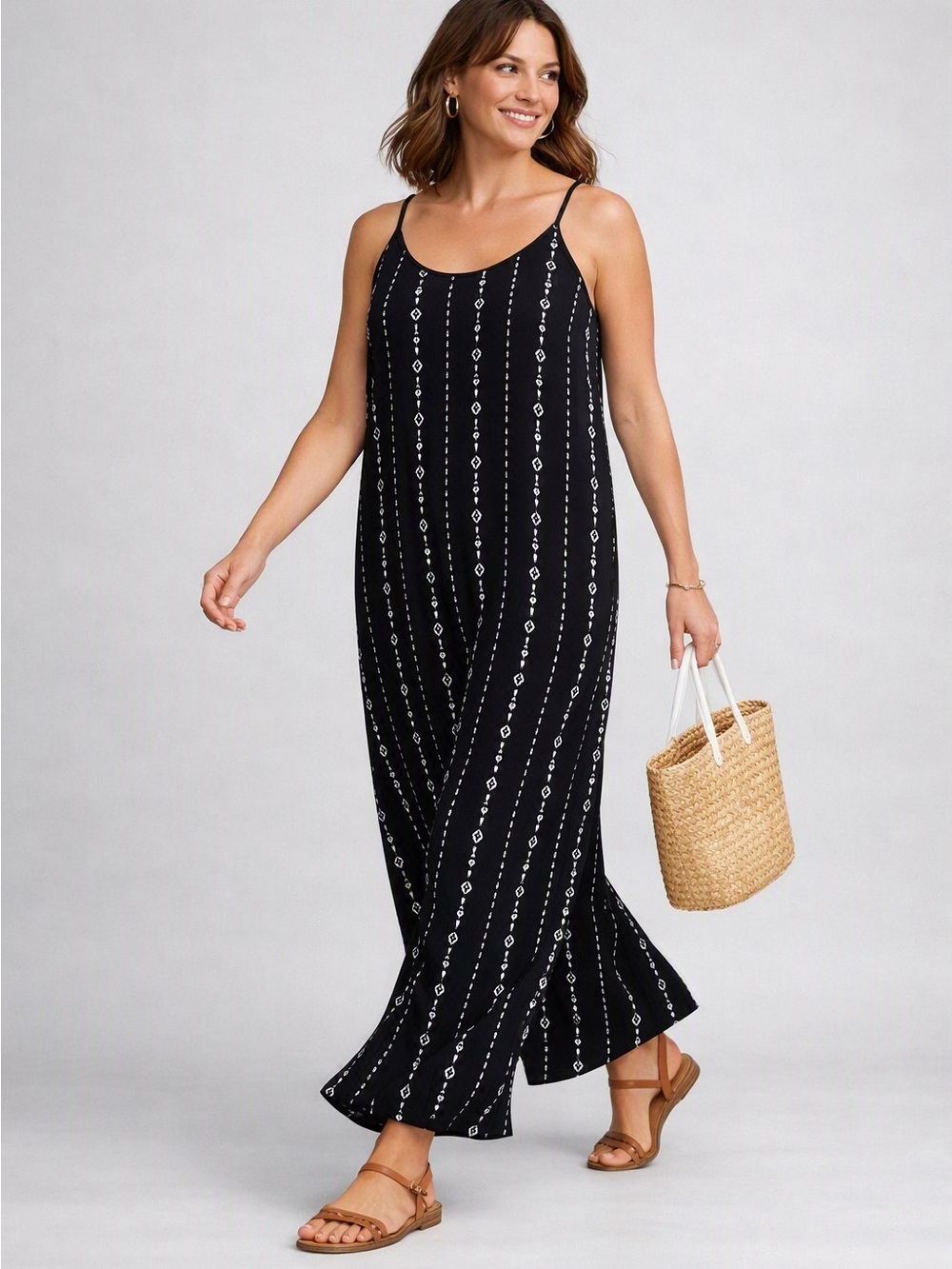 Black Patterned Maxi Jumpsuit with adjustable Spaghetti Straps.
